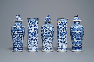 A Chinese blue and white five-piece garniture with peacocks, Kangxi mark, 19th C.