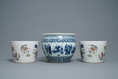 A pair of Chinese famille rose jardini&egrave;res and a blue and white example, 19th C.