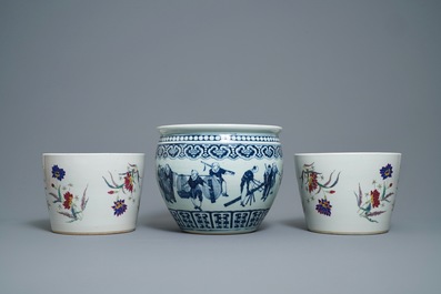 A pair of Chinese famille rose jardini&egrave;res and a blue and white example, 19th C.