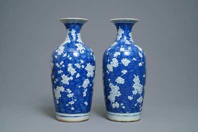 A pair of Chinese blue and white 'prunus on cracked ice' vases, 19th C.