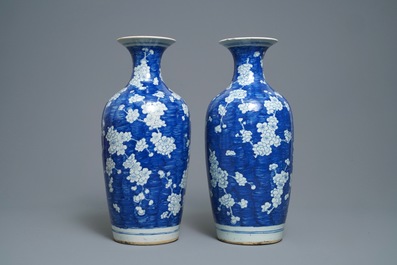 A pair of Chinese blue and white 'prunus on cracked ice' vases, 19th C.