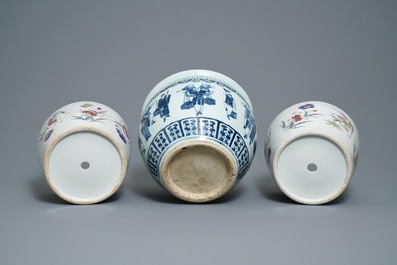 A pair of Chinese famille rose jardini&egrave;res and a blue and white example, 19th C.