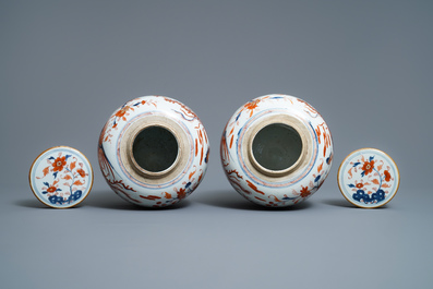 A pair of Chinese Imari-style 'qilin and phoenix' jars and covers, Kangxi