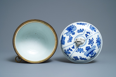 A Chinese blue and white bowl and cover with gilt bronze mounts, Kangxi