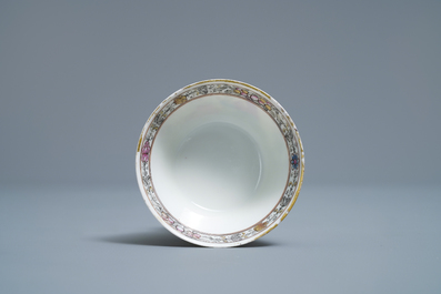 A Chinese famille rose 'amorous couple' cup and saucer, Qianlong