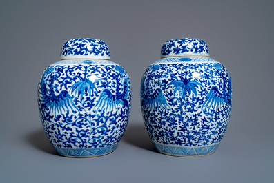 A pair of Chinese blue and white covered 'phoenix' jars, Kangi mark, 19th C.