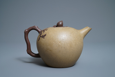 A large Chinese Yixing stoneware teapot with applied prunus design, Kangxi