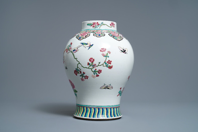 A Chinese famille rose vase, a brush pot and a famille verte bowl, 19th C.