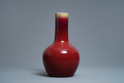 A Chinese monochrome sang-de-boeuf bottle vase, 19th C.