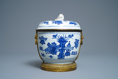 A Chinese blue and white bowl and cover with gilt bronze mounts, Kangxi