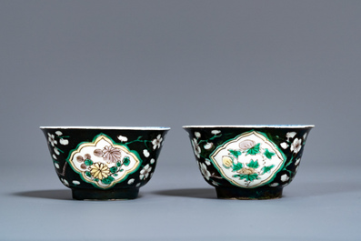 A pair of rare Chinese famille noire cups and saucers, Kangxi