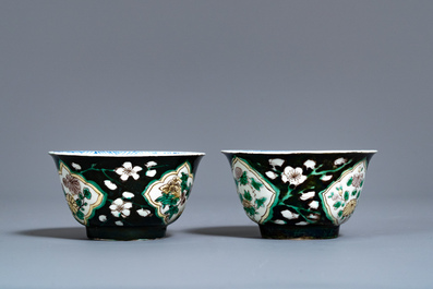 A pair of rare Chinese famille noire cups and saucers, Kangxi