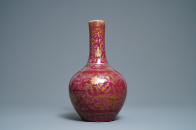 A Chinese gilt-decorated flamb&eacute;-glazed bottle vase, 19th C.