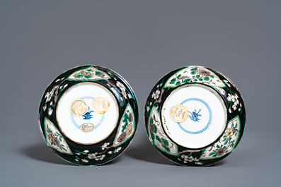 A pair of rare Chinese famille noire cups and saucers, Kangxi