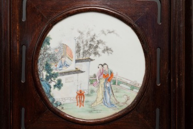 A Chinese wooden room divider with famille rose 'Romance of the Western Chamber' plaques, Republic