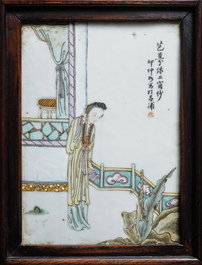 Une armoire en bois sculpt&eacute; orn&eacute;e de 23 plaques en porcelaine de Chine qianjiang cai, 19/20&egrave;me