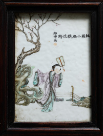 Une armoire en bois sculpt&eacute; orn&eacute;e de 23 plaques en porcelaine de Chine qianjiang cai, 19/20&egrave;me