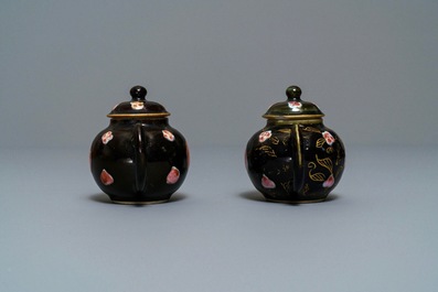 A pair of Chinese famille rose black-ground teapots and covers, Yongzheng/Qianlong