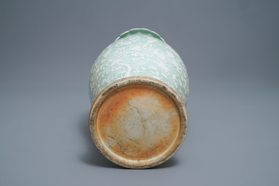 A large Chinese slip-decorated celadon-ground vase, 19th C.