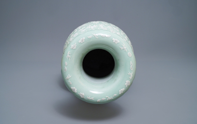 A large Chinese slip-decorated celadon-ground vase, 19th C.