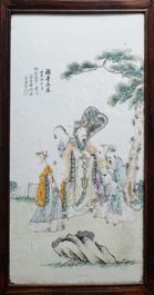 Une armoire en bois sculpt&eacute; orn&eacute;e de 23 plaques en porcelaine de Chine qianjiang cai, 19/20&egrave;me