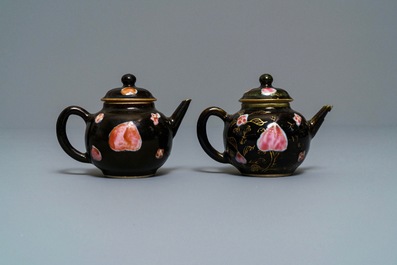 A pair of Chinese famille rose black-ground teapots and covers, Yongzheng/Qianlong