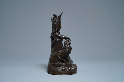 A Chinese silver-inlaid bronze figure of Guanyin on a dragon, Shisou mark, 18/19th C.