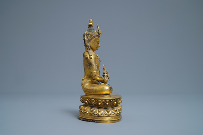 A Chinese coral- and turquoise-inlaid gilt bronze figure of Buddha Amitayus, 18/19th C.