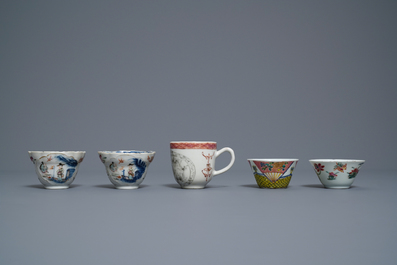 Five Chinese famille rose cups and saucers and two 'Mandarin' teapots, Yongzheng/Qianlong