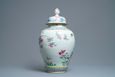 A large Chinese famille rose vase and cover with a bird on blossoming branches, Yongzheng