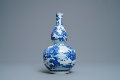 A Chinese blue and white double gourd vase, Transitional period