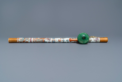 A Chinese famille rose opium pipe with silk pouch, 19th C.