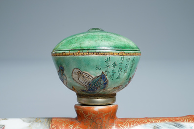 A Chinese famille rose opium pipe with silk pouch, 19th C.