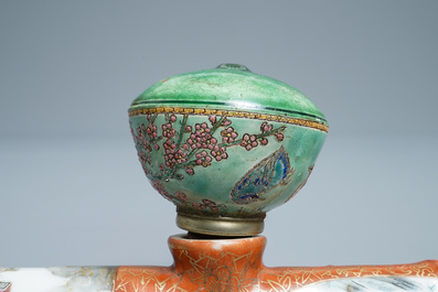 A Chinese famille rose opium pipe with silk pouch, 19th C.