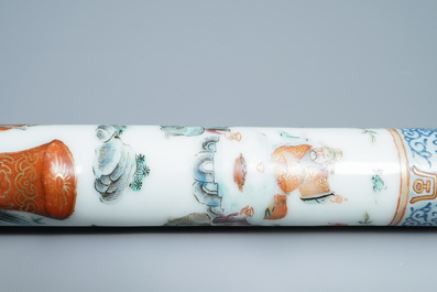 A Chinese famille rose opium pipe with silk pouch, 19th C.