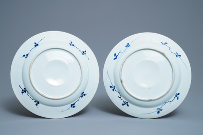 A pair of Chinese blue and white dishes with raised central medallions, Kangxi