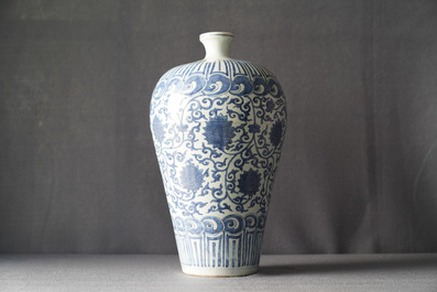 An imperial Chinese blue and white 'lotus scroll' meiping vase, Wanli mark and of the period