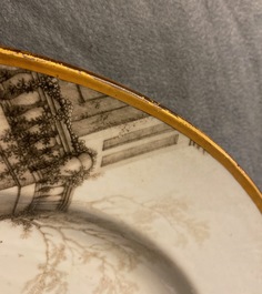 A Chinese grisaille 'Return from the hunt' dish with a coat of arms on the back, Qianlong