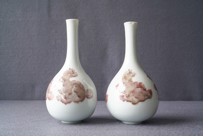 A pair of Chinese copper red 'mythical beasts' vases, Kangxi