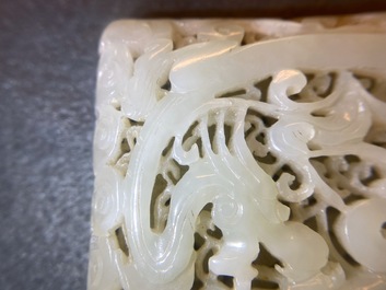 A Chinese reticulated pale celadon jade 'dragon and phoenix' carving, Ming