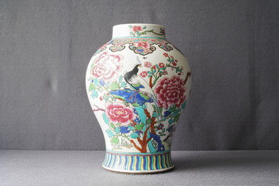 A Chinese famille rose vase, a brush pot and a famille verte bowl, 19th C.