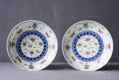 A pair of Chinese doucai 'ducks in a lotus pond' plates, four-character mark, Republic