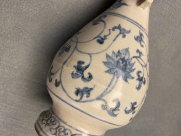 Un vase en porcelaine de Chine en bleu et blanc &agrave; d&eacute;cor de rinceaux de lotus, Yuan