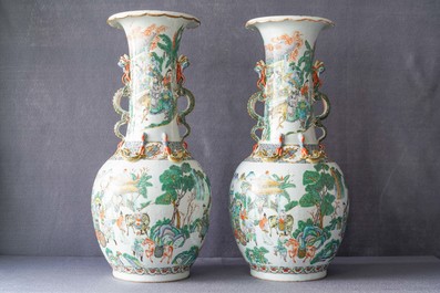 A pair of Chinese Canton famille verte vases with dragon handles, 19th C.