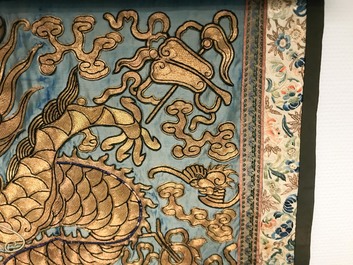 A Chinese gold-thread embroidered silk dragon wall tapestry, 19th C.