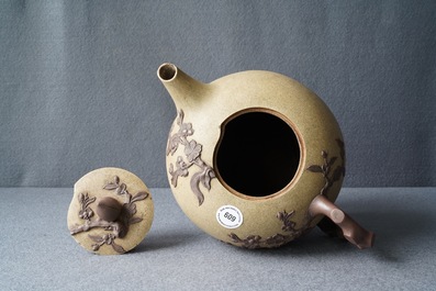 A large Chinese Yixing stoneware teapot with applied prunus design, Kangxi