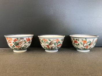 Nine Chinese famille verte cups and saucers with birds among blossoms, Kangxi