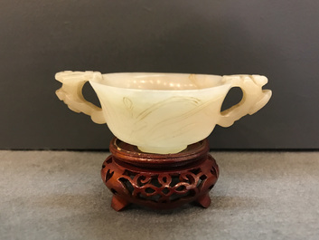 A Chinese pale celadon jade libation cup, 18/19th C.