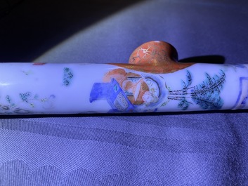 A Chinese famille rose opium pipe with silk pouch, 19th C.