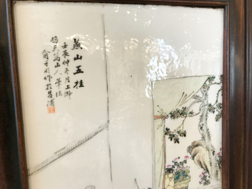 Une armoire en bois sculpt&eacute; orn&eacute;e de 23 plaques en porcelaine de Chine qianjiang cai, 19/20&egrave;me